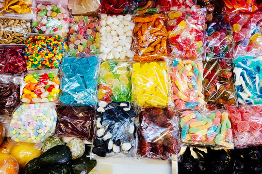 Variety of candies in plastic bags
