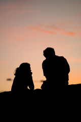 Fototapeta na wymiar couple talking background sunset