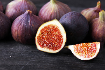 Fresh figs. Food Photo. whole and sliced figs on beautiful rustic background.