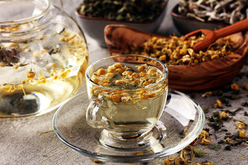 tea with Chamomile, sage and stinging nettle tea. Dried chamomile tea on table