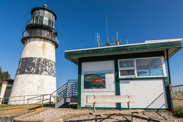 USA, Washington State, Ilwaco, Cape Disappointment State Park. The Cape Disappointment Lighthouse and US Coast Guard Columbia River Bar observation station.