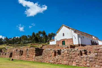 White building and rustic walls in Chinchero