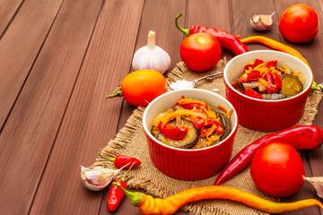 Marinated salad with pickled vegetables: eggplant, carrot, pepper, tomato, garlic