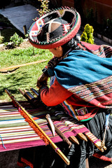 Peruvian woman with colorful textiles