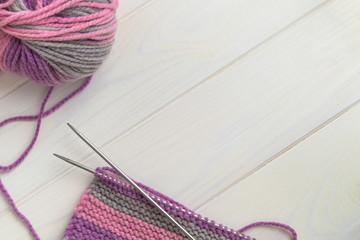 ball of wool knitting needles and knitting