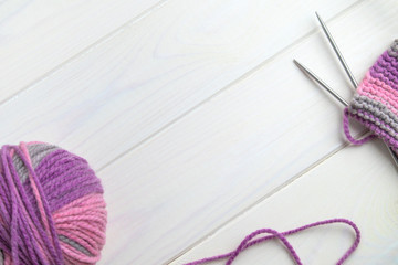 ball of wool knitting needles and knitting