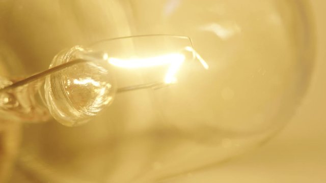 Macro shot of a lightbulb turning on
