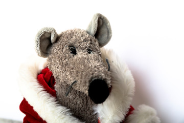 Christmas background. Xmas rat, mouse toy, symbol chinese happy new year 2020. Close up mouse toy in santa claus red hat and new year decorations. horoscope sign 2020. Copy space