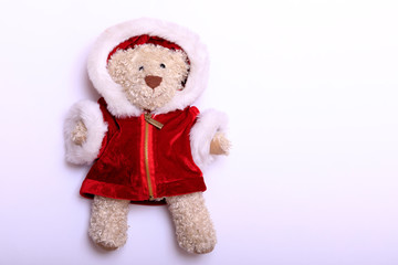 Teddy bear wearing Christmas or New Year on white background