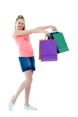 Little girl with multi-colored bags in their hands.