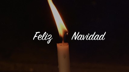 Close up of moving candle with Christmas animation. Magical sparkling particles moving through the screen. Appearing white letters Feliz Navidad (Spanish), in English translated Merry Christmas. 4K - Powered by Adobe