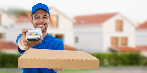 smiling pizza delivery man with pizza boxes and houses