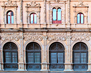 Front of arab architecture detail in the spanish city of Seville in a sunny day