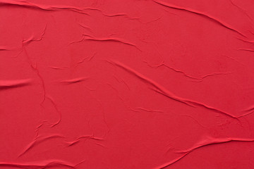 Red crumpled sheet of paper close-up.