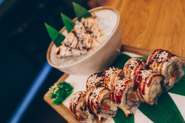 Sushi Warm Ebi Sake Unagi Spring plateau buffet in night dining restaurant flat lay. Delicious Smoked salmon rolls flesh seaweed and ginger. The norwegian salmon and Fish.