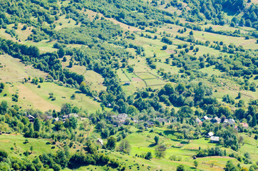 Ukraine Carpathians, a settlement in a valley of mountains, beautiful landscape aerial view