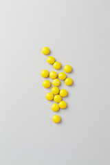 Vitamin C tablets. Bright background. Top view. Copy space.  