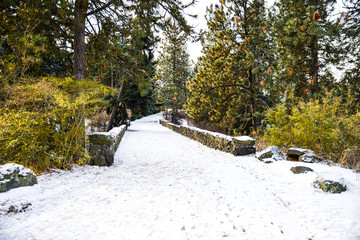 White Icy Snowy Walkway Through A Foot Bridge At A Park In Freezing Winter, Spokane, Washington, United States.