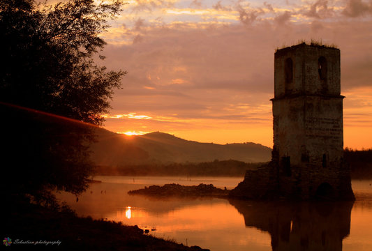 church ruins in lake water in the morning