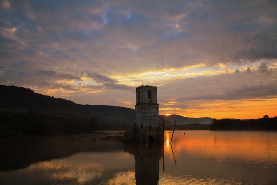 church ruins in lake water in the morning