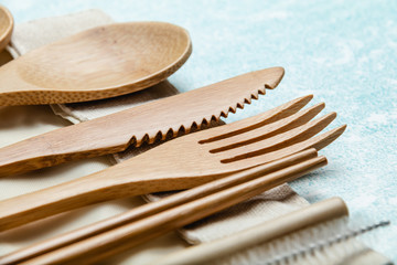 Eco friendly bamboo cutlery set on blue background. Zero waste concept
