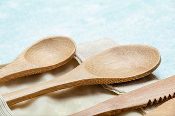 Eco friendly bamboo cutlery set on blue background. Zero waste concept