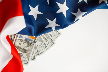 American Dollars Cash Money.  One hundred dollars banknotes close-up on  USA flag background
