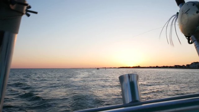 Fishing out of Hatteras harbor at sunrise - 4K
