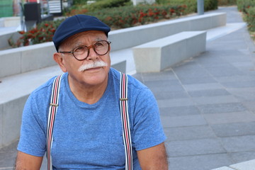 Stylish senior Hispanic man outdoors