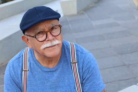 Stylish senior Hispanic man outdoors