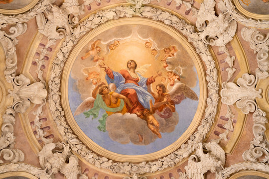 RIVA DEL GARDA, ITALY - JUNE 13, 2019: The ceiling fresco of Assumption of Virgin Mary in church Chiesa di Santa Maria Assunta (Cappella del Suffragio) by Giuseppe Craffonara (19 cent.).
