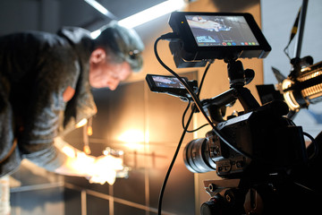 Behind the scenes of filming movies and video products, setting up equipment for shooting video and...
