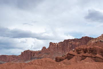 Fototapeta na wymiar Capitol Reef National Park low angle landscape of pink and red stone hillside