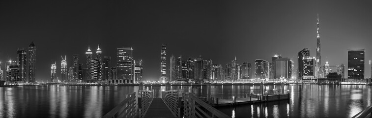 Dubai - The evening skyline over the Canal and Downtown.