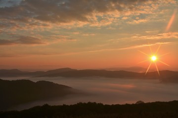 fog between hills in the morning
