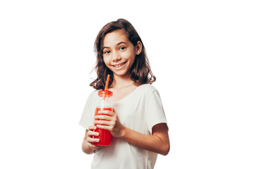 Portrait of girl with a bottle of juice isolated on white background
