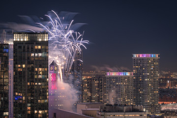 city at night and fireworks