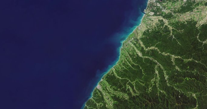 Very high-altitude overflight aerial of southeast coastline of Hokkaido, Japan. Clip loops and is reversible. Elements of this image furnished by NASA