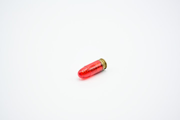 Dry Fire Training on a white background, Fake bullets made from red plastic are used for shooting...