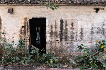 abandoned house with broken wooden door