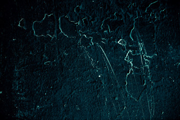 Vintage azure background. Rough painted wall of turquoise color. Imperfect plane of cyan colored. Uneven old decorative toned backdrop of aqzure tint. Texture of teal hue. Ornamental stony surface.