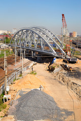 Under construction railway bridge over the railway tracks.Horizontally.Vertically.