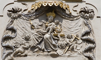 PRAGUE - MARCH 8: Baroque relief of Madonna from facade of old house from 17. cent. on March 8, 2004 in Prauge.
