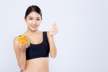 Beautiful portrait young asian woman smiling holding salad vegetable food isolated on white background, girl diet eating vegetarian for healthy, health care or wellness concept.