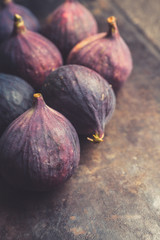 Fresh ripe figs on the rustic background. Selective focus. Shallow depth of field.