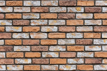 Closed up orange brick wall texture. Architectural material construction.