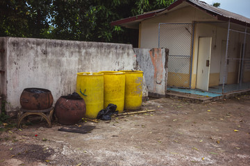 Old yellow trash empty  on the wall