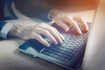 young man works with computer