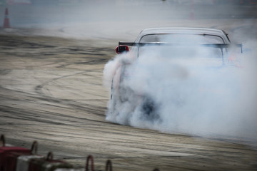 Close up drift car, Side view  drift car selective focus.Drift car with  smoke from burning tires