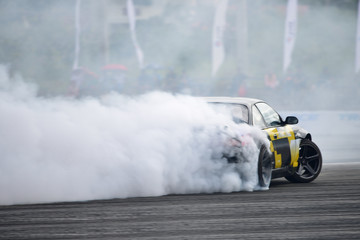 Motion blur close up drift car with  smoke from burning tires - obrazy, fototapety, plakaty